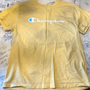 A champion pastel yellow shirt